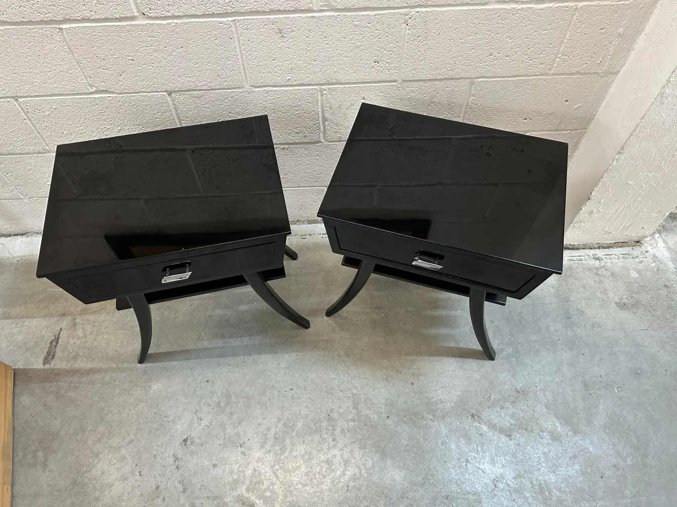 two antique black bedside tables with elegant design