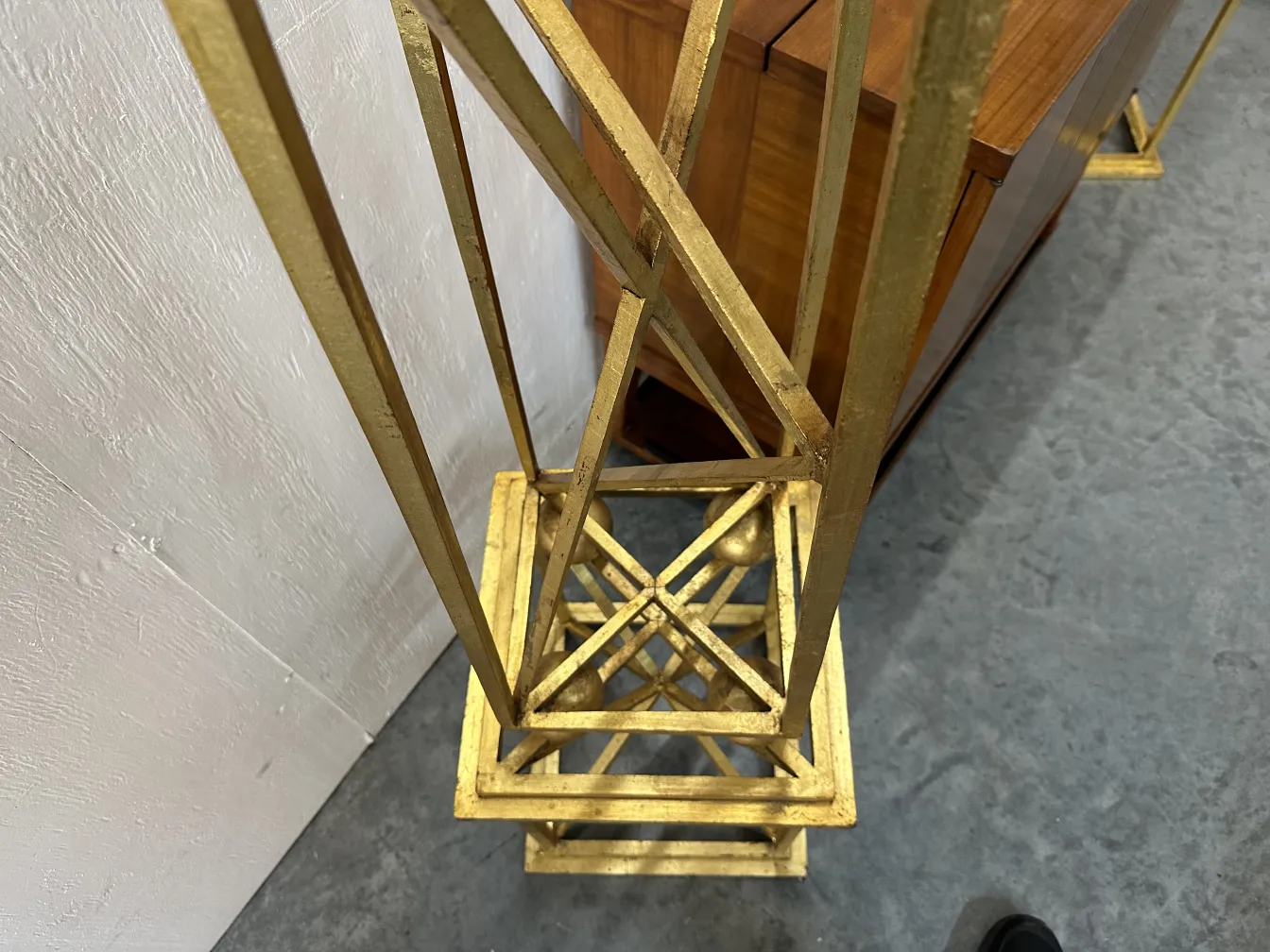 two antique decorative obelisks in an elegant setting