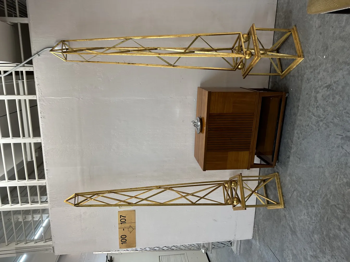 Two antique decorative obelisks in a modern setting