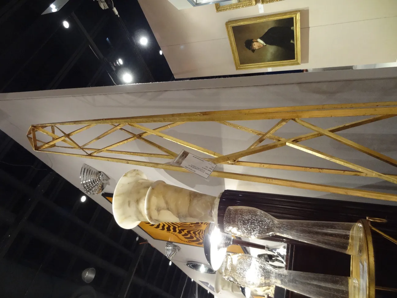 two antique obelisks on display with ornamental details