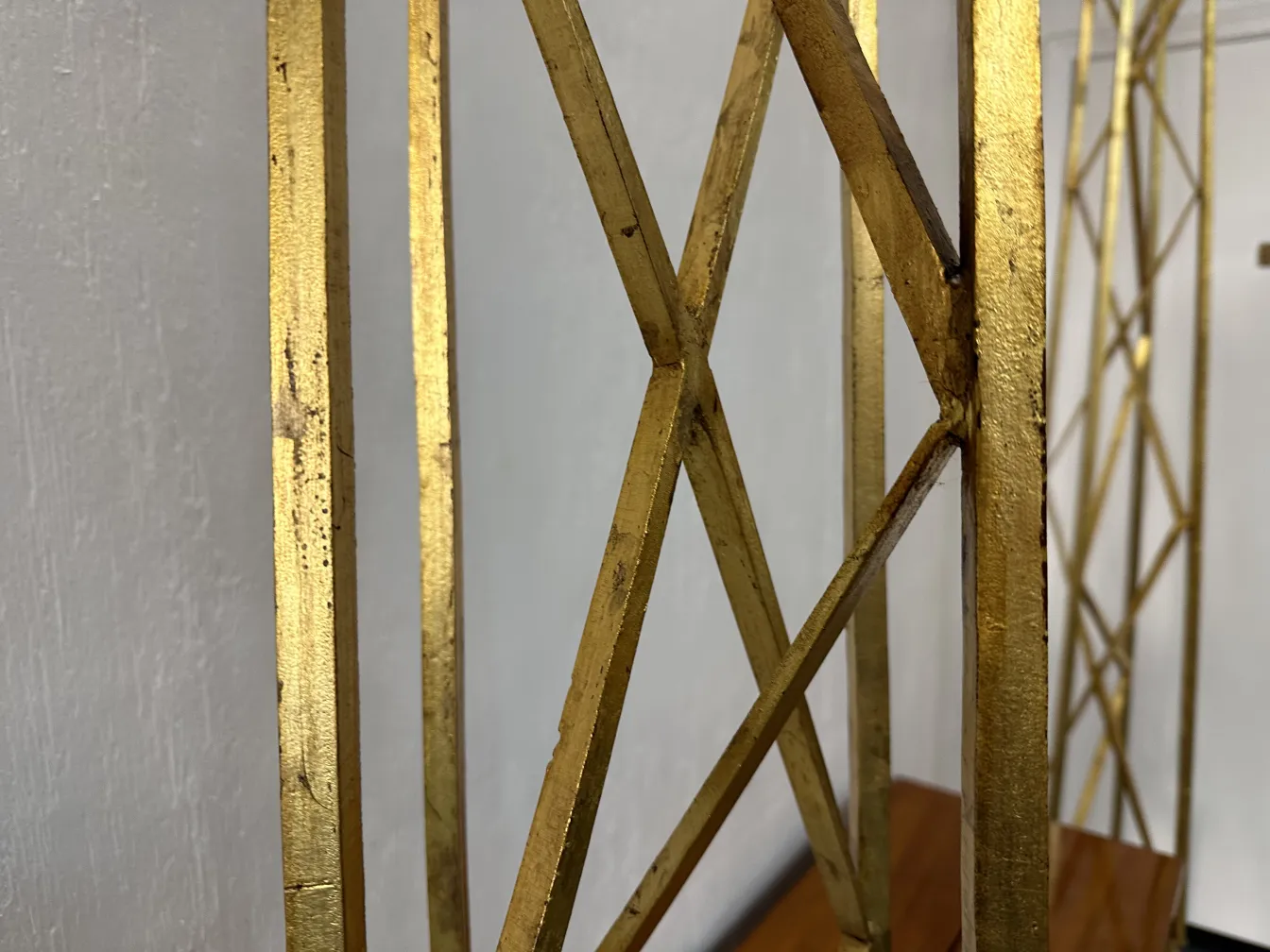 two antique obelisks with decorative golden details