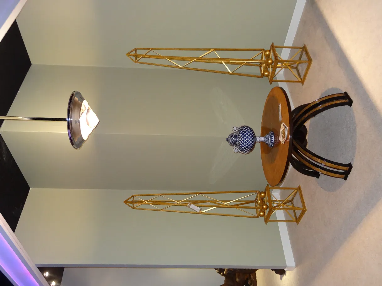 two golden obelisks in an antique display