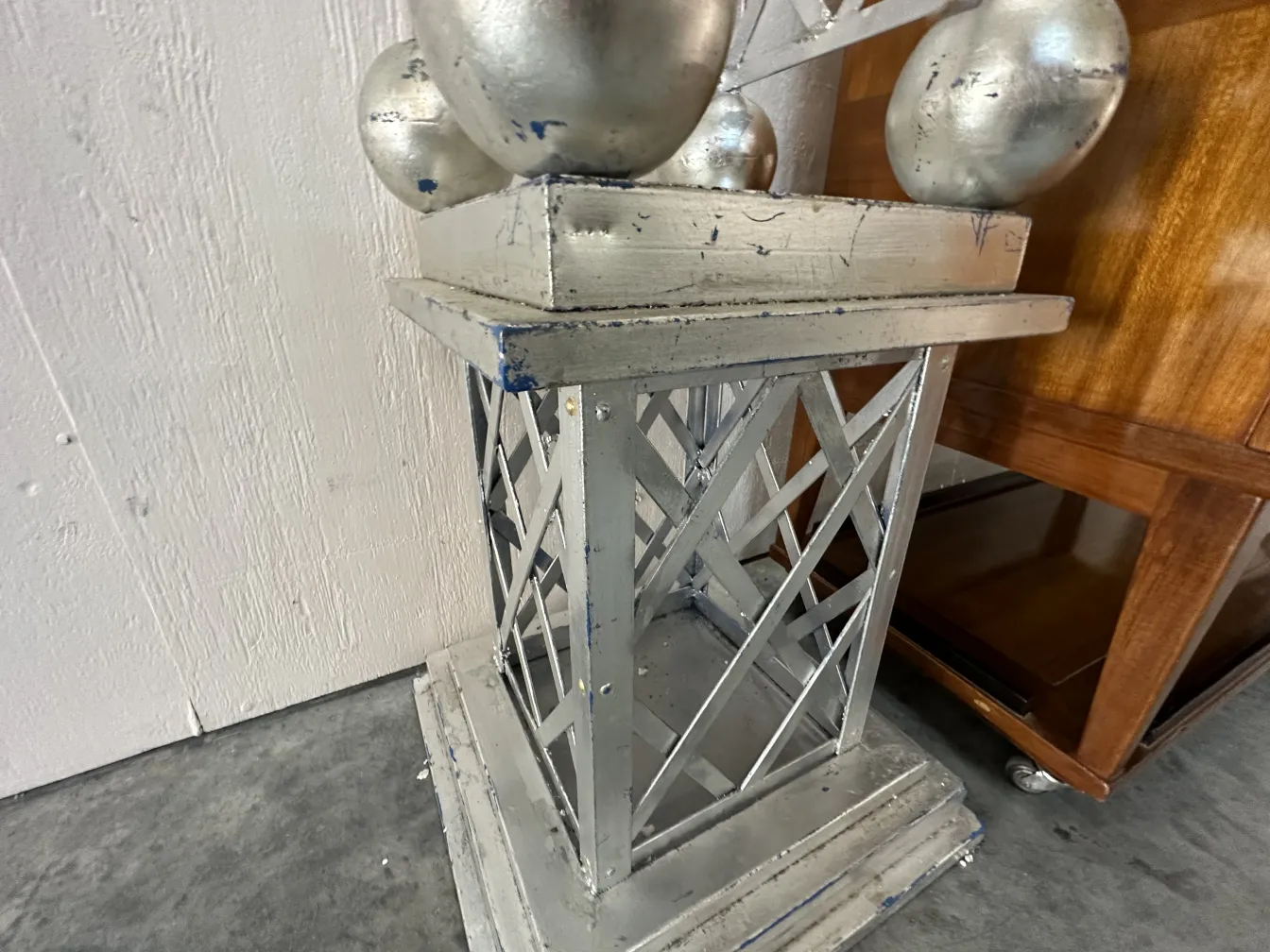 Ancient obelisk with decorative base and spheres on top