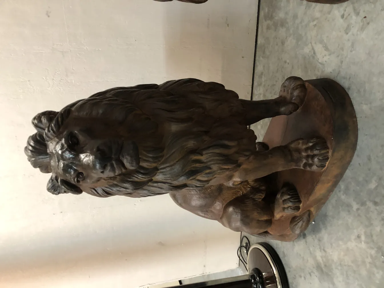antique sculpture of 2 lions, fierce expression