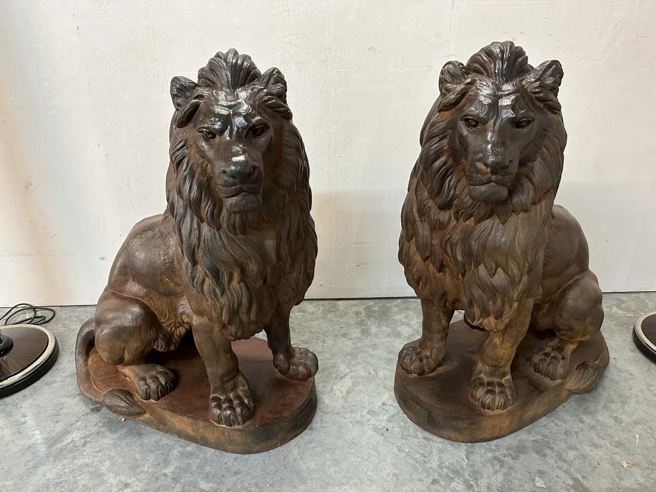 Antique sculpture of two lions with realistic details and mane