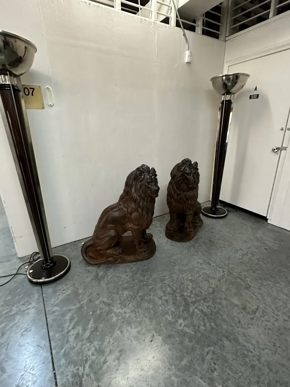 Antique lions by A. Durenne in an indoor setting