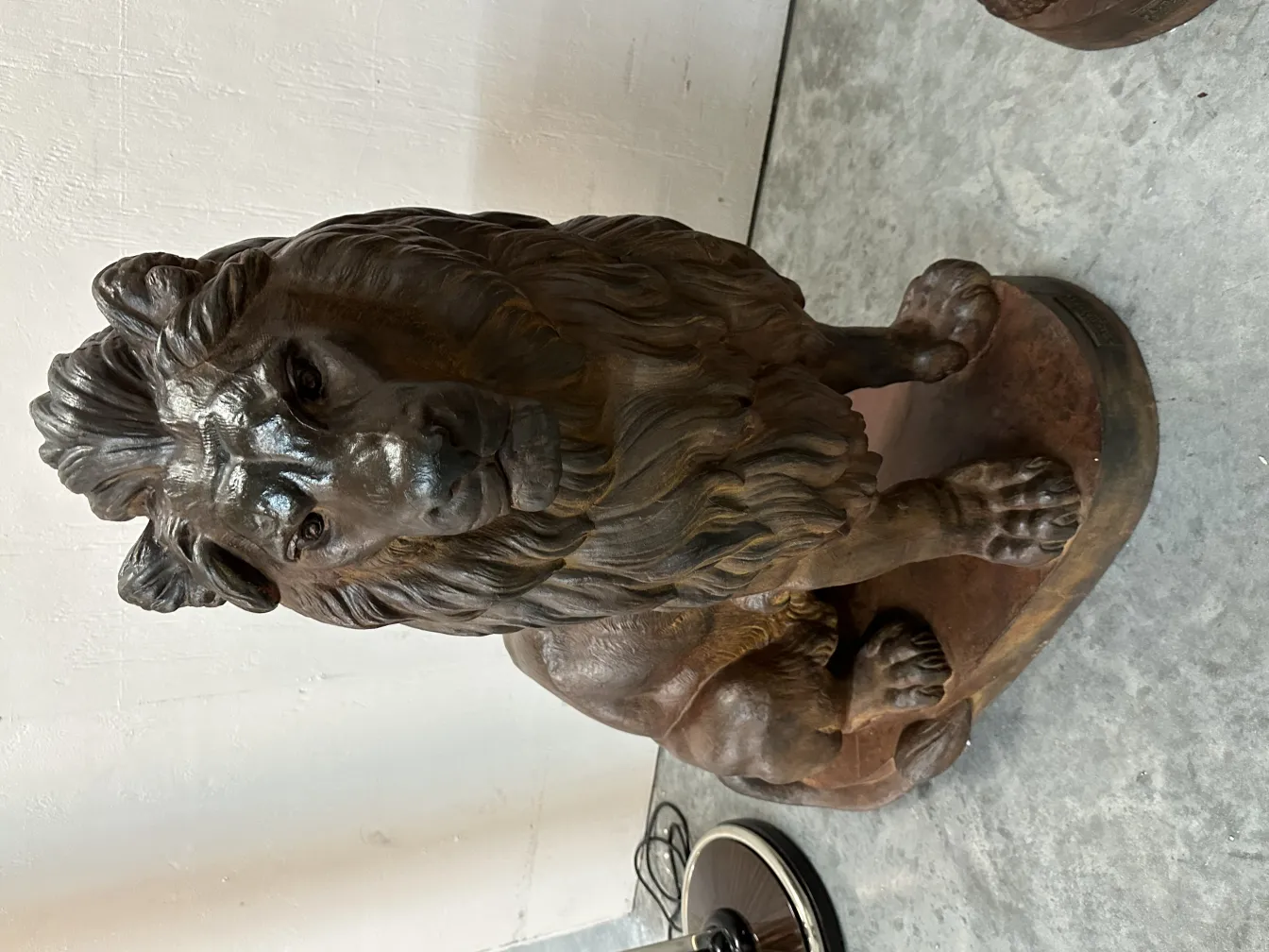 Sculpture of 2 antique lions in realistic posture, with detailed manes.