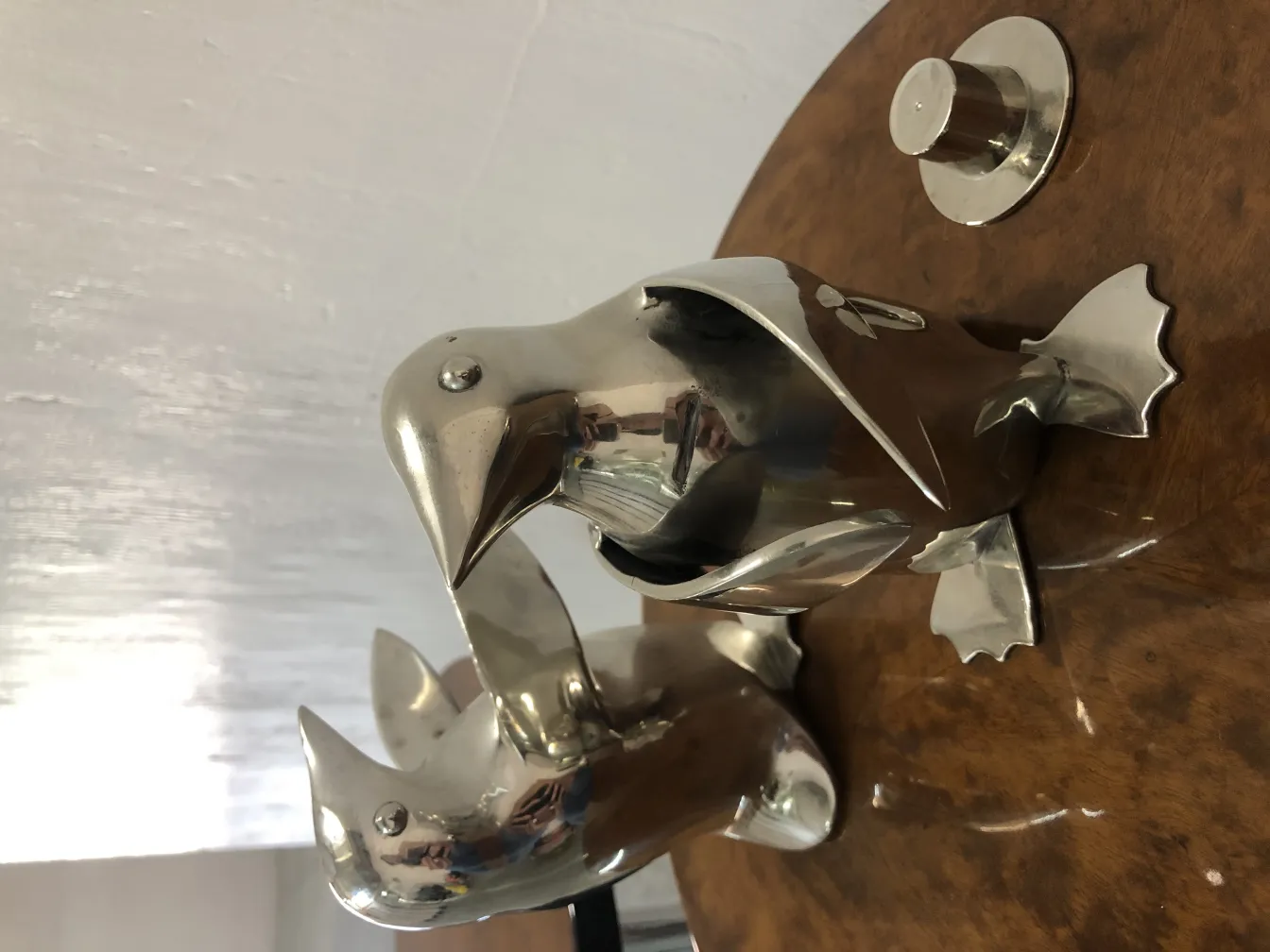 two antique penguins with shiny details