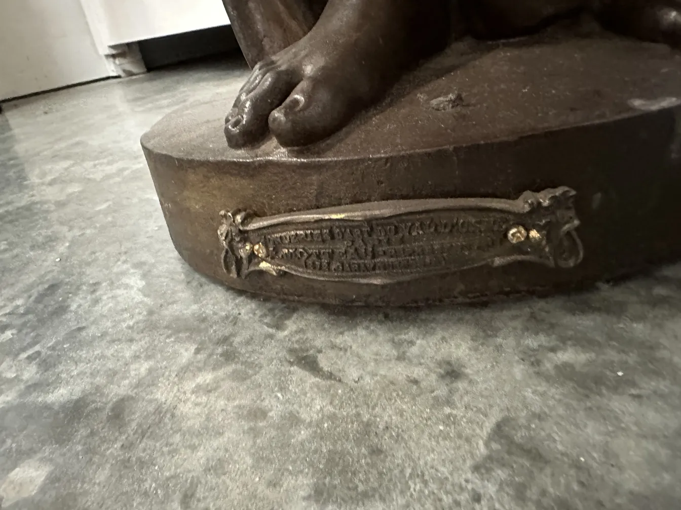 antique sculpture with base and ornate details