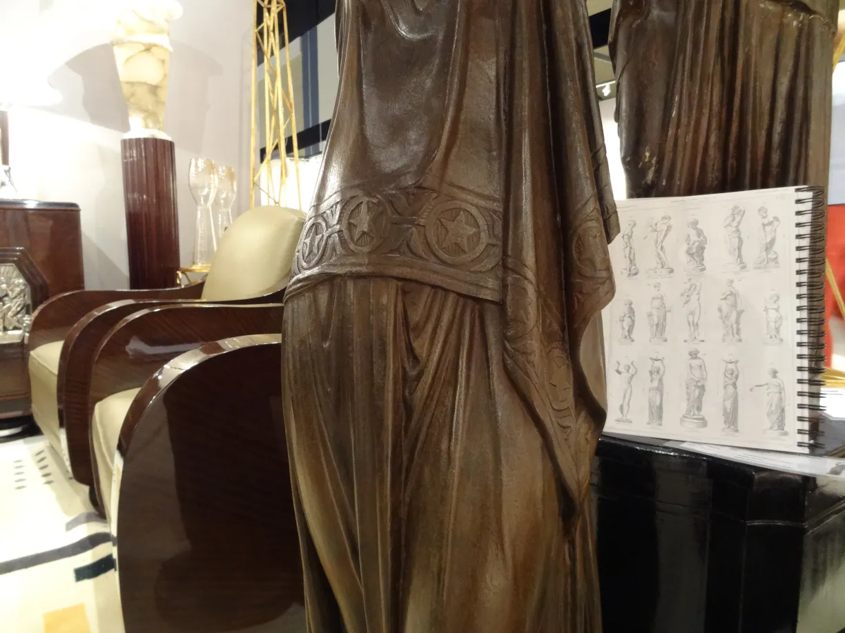 Antique sculpture with intricate details and modern background