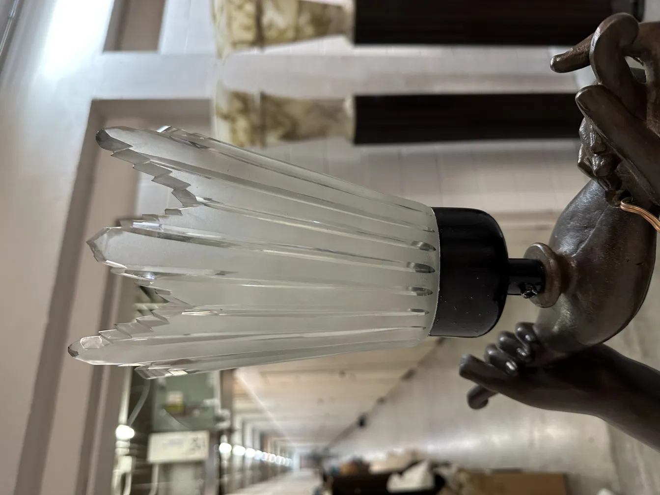 Antique Val D'Osne sculpture with intricate details and an elegant atmosphere.