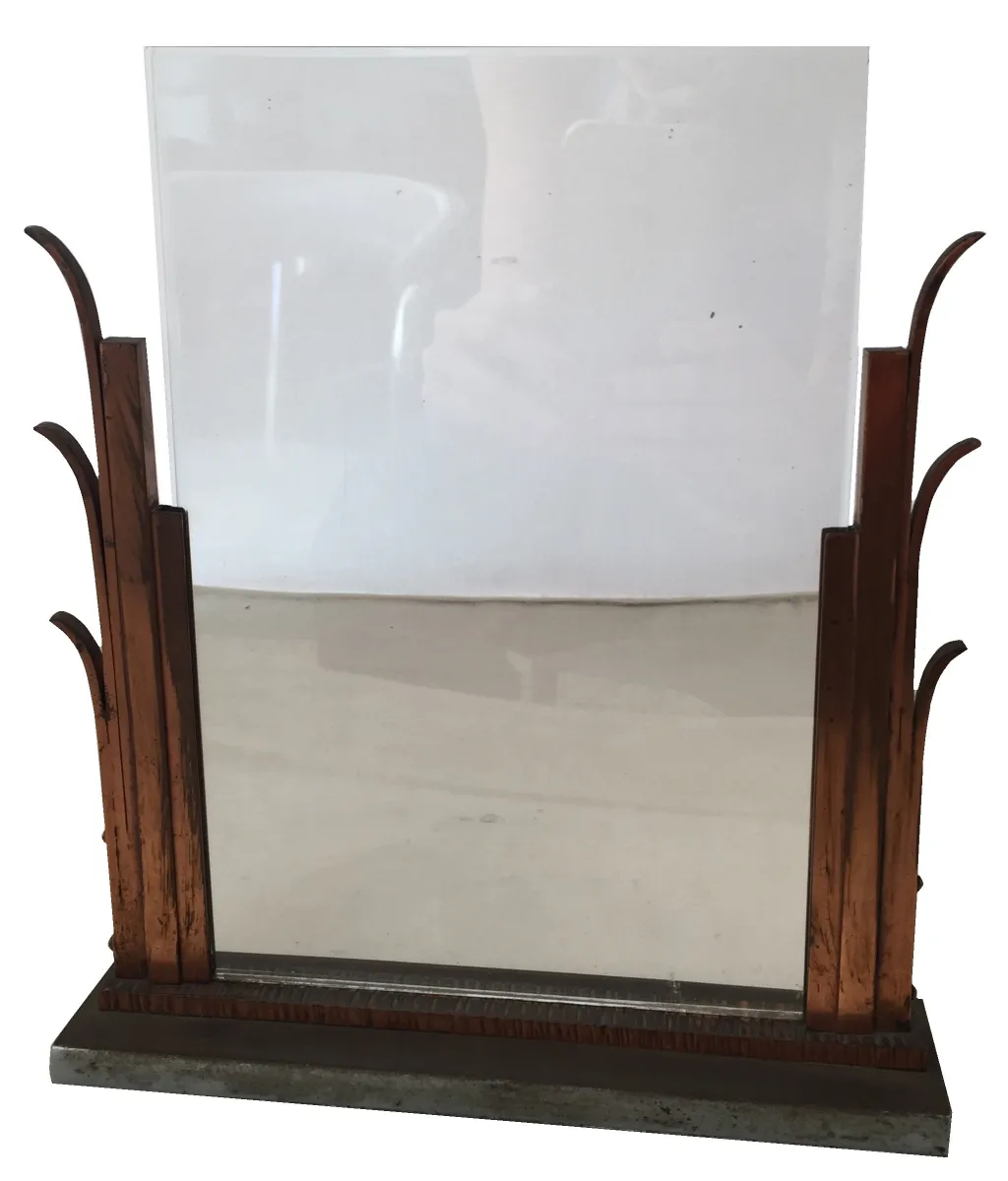 Antique picture frame with artistic design, set in a cozy environment.