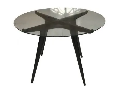 Antique dining table, round and elegant, for 4 people, in a cozy setting.