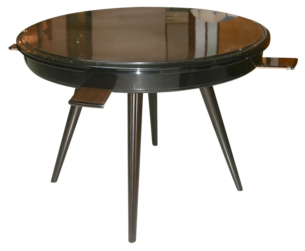 Mesa de comedor antigua redonda y elegante para 4 personas en un ambiente acogedor.