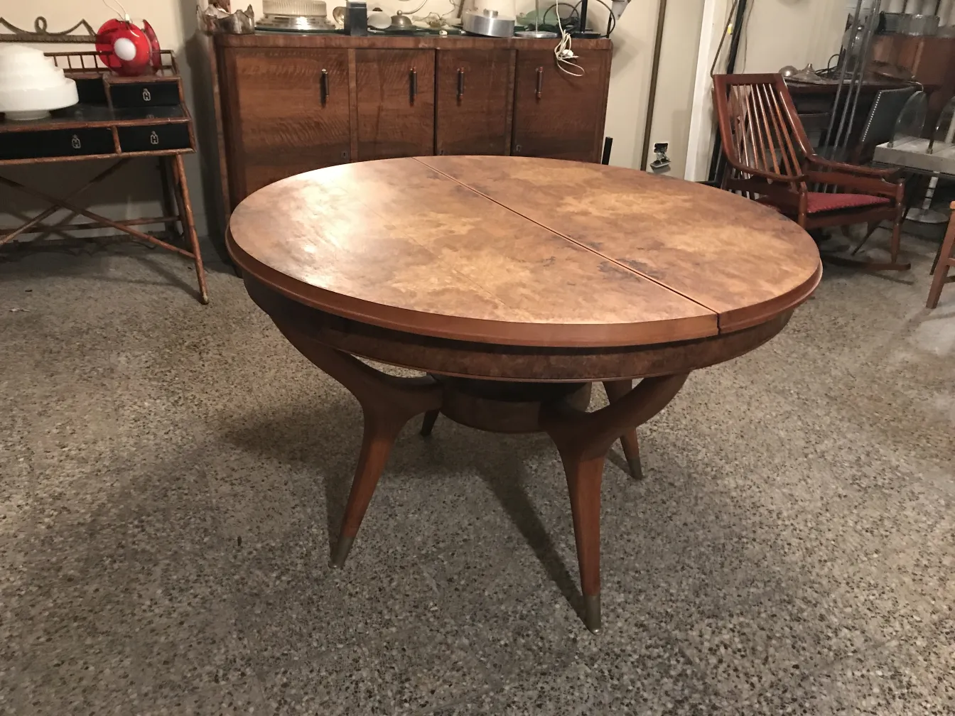 Antique dining table with a round design and stylish legs in a cozy setting.