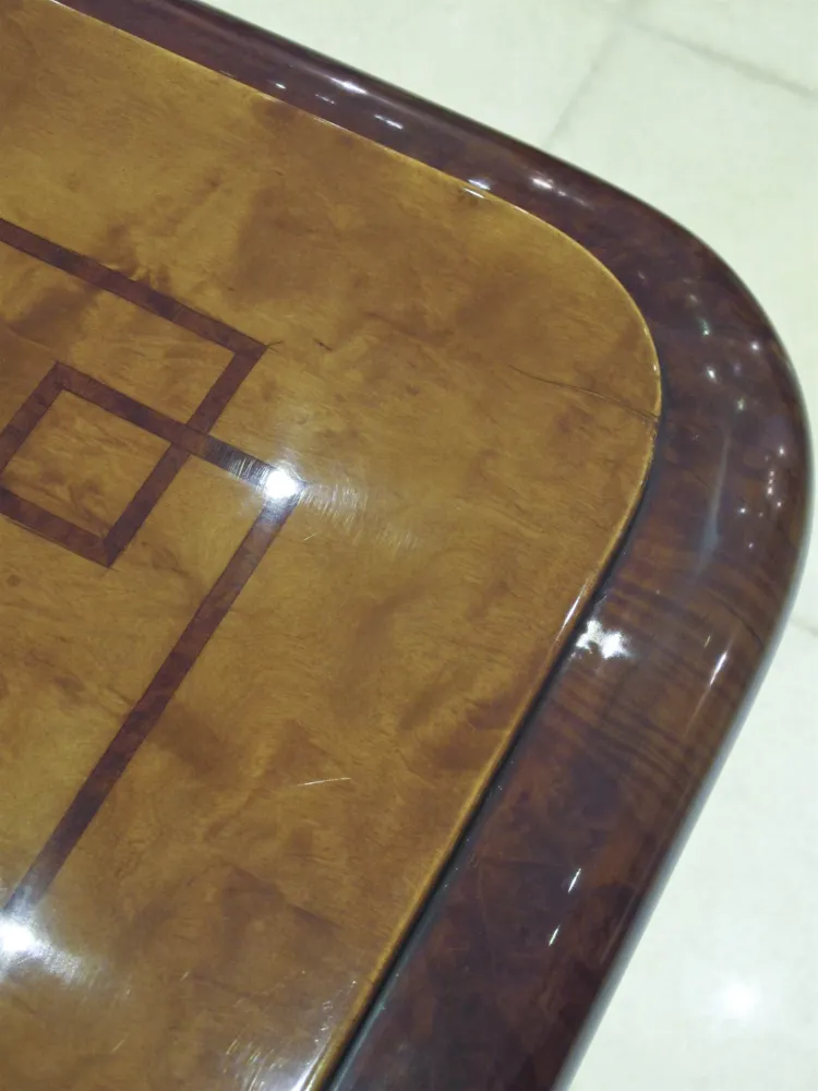 Antique dining table for ten people, elegant design.