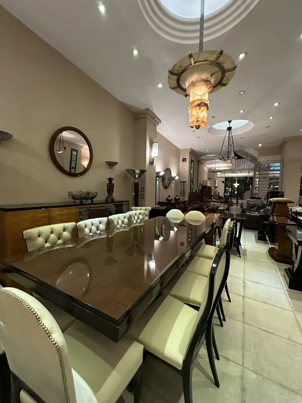 Antique dining table for 10 people in an elegant setting