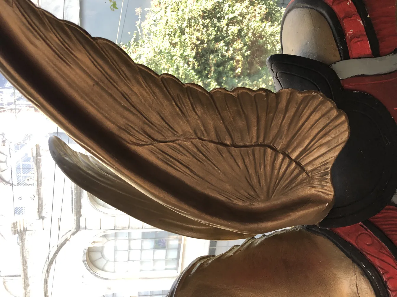 Antique decorative unicorn featuring intricate design with golden details