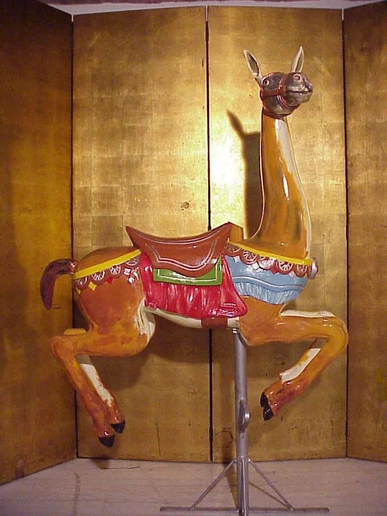 antique llama sculpture in vibrant colors, decorated.