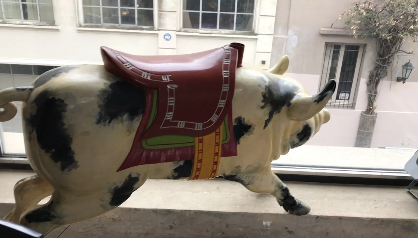 antique decorative figurine of a pig with a saddle