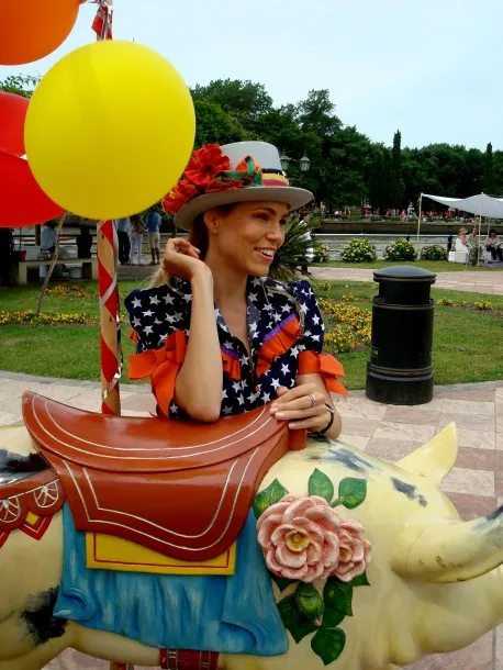 Antique pig decoration with flowers and saddle