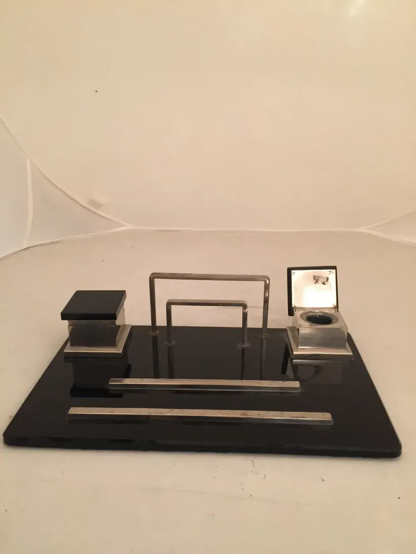 antique inkwell with an elegant shape, decorated with details, includes a stand