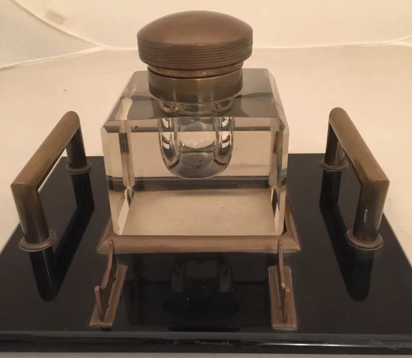 antique glass inkwell with shiny details, elegant setting