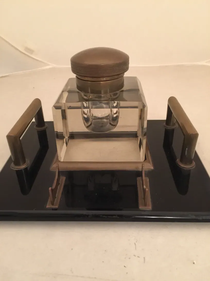 antique inkwell with elegant shapes on black base