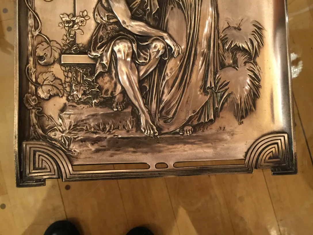 decorative details of 2 antique wall plaques with figure