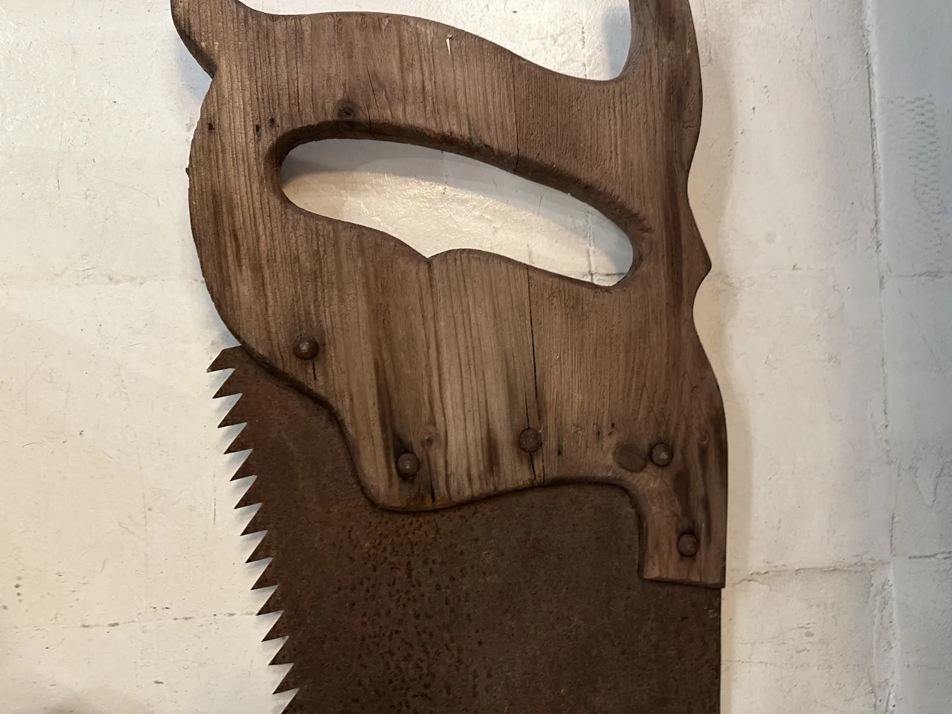 Antique advertising hand saw with decorative design and details