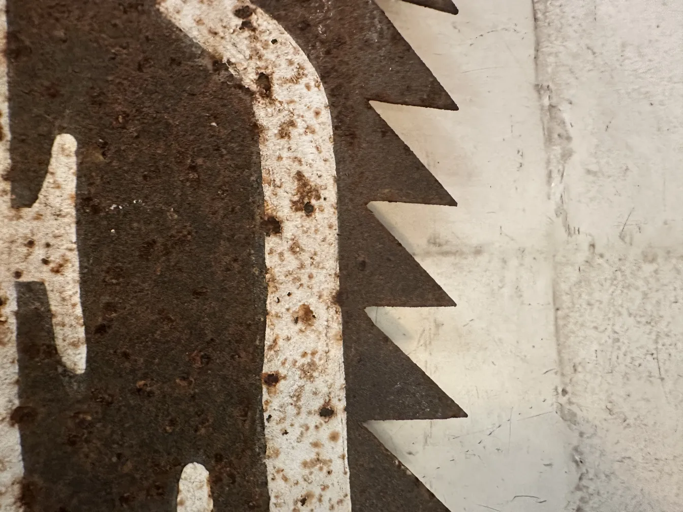 Antique hand saw with visible marks, suitable for advertising.