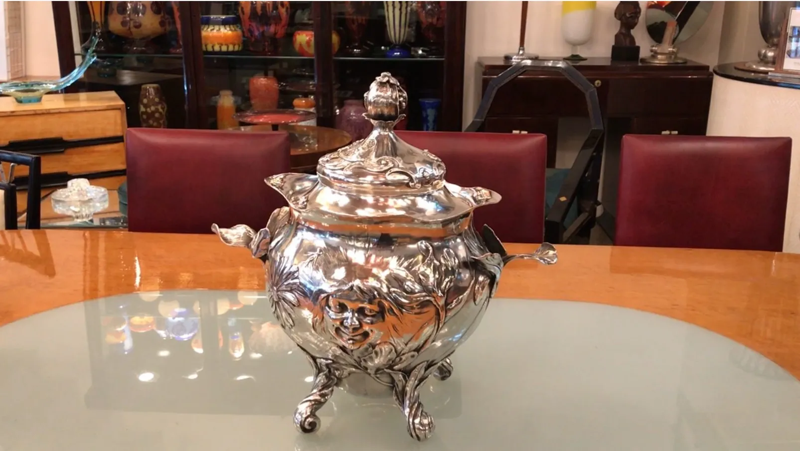 antique WMF punch bowl with intricate design and decorative legs