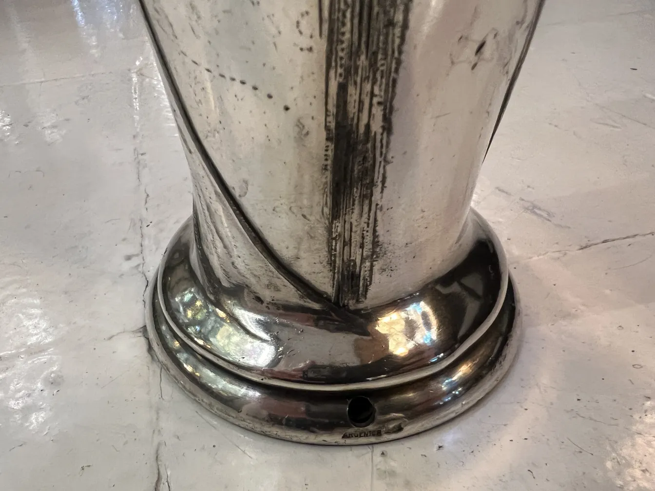 Antique vase with a curved and shiny design