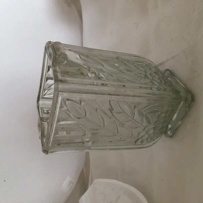 antique carved decorative vase with leaf design