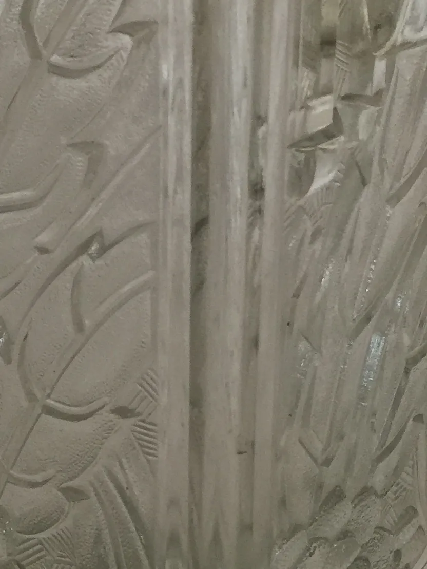 antique vase with carved leaf and flower reliefs