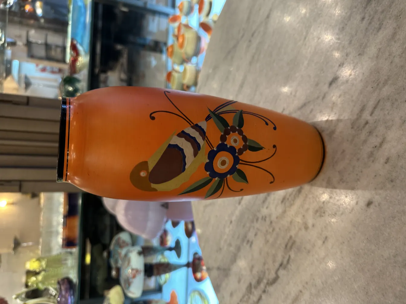 vase ancien orange avec motif floral