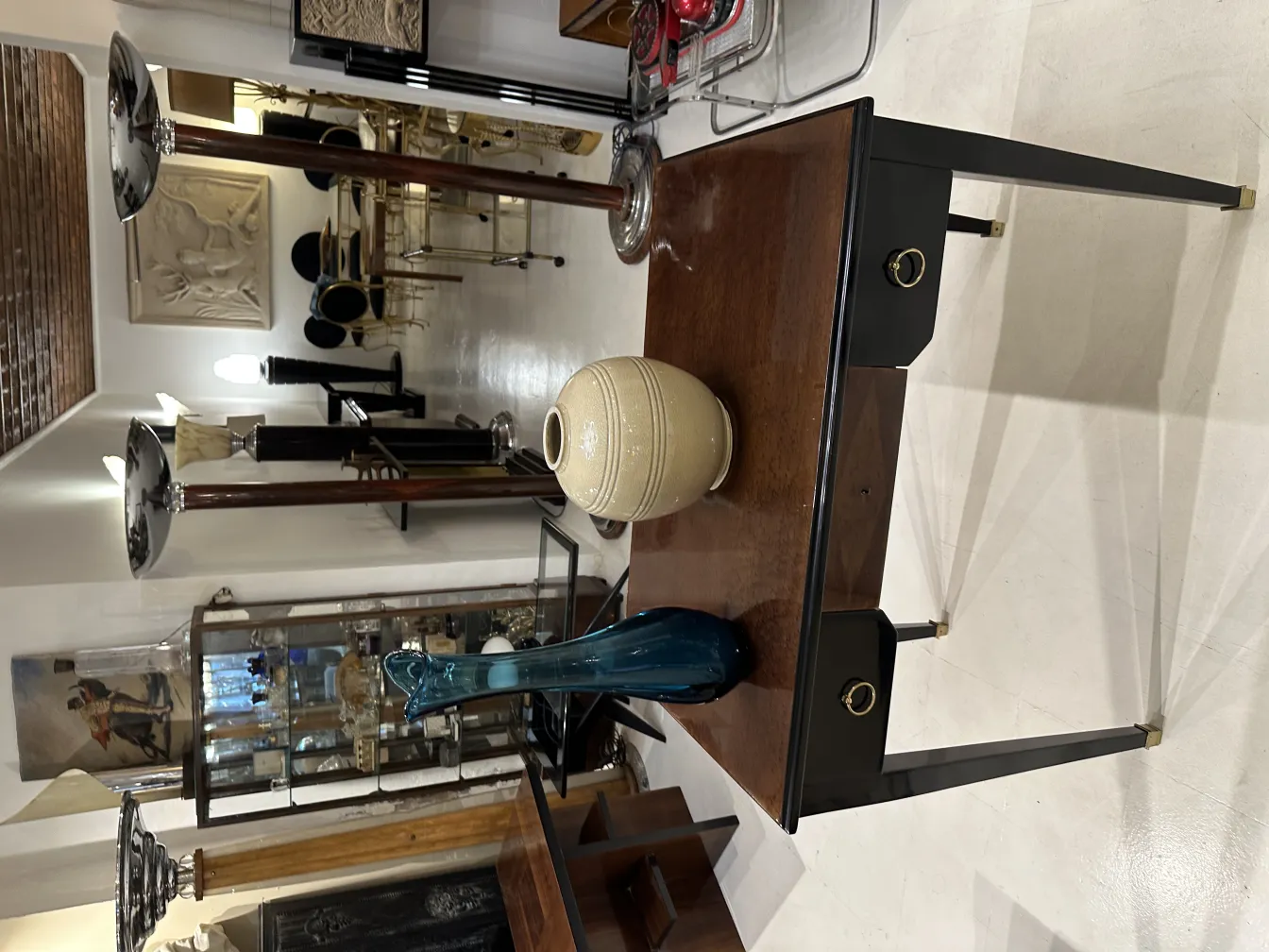 antique vase on a table with other decorative items