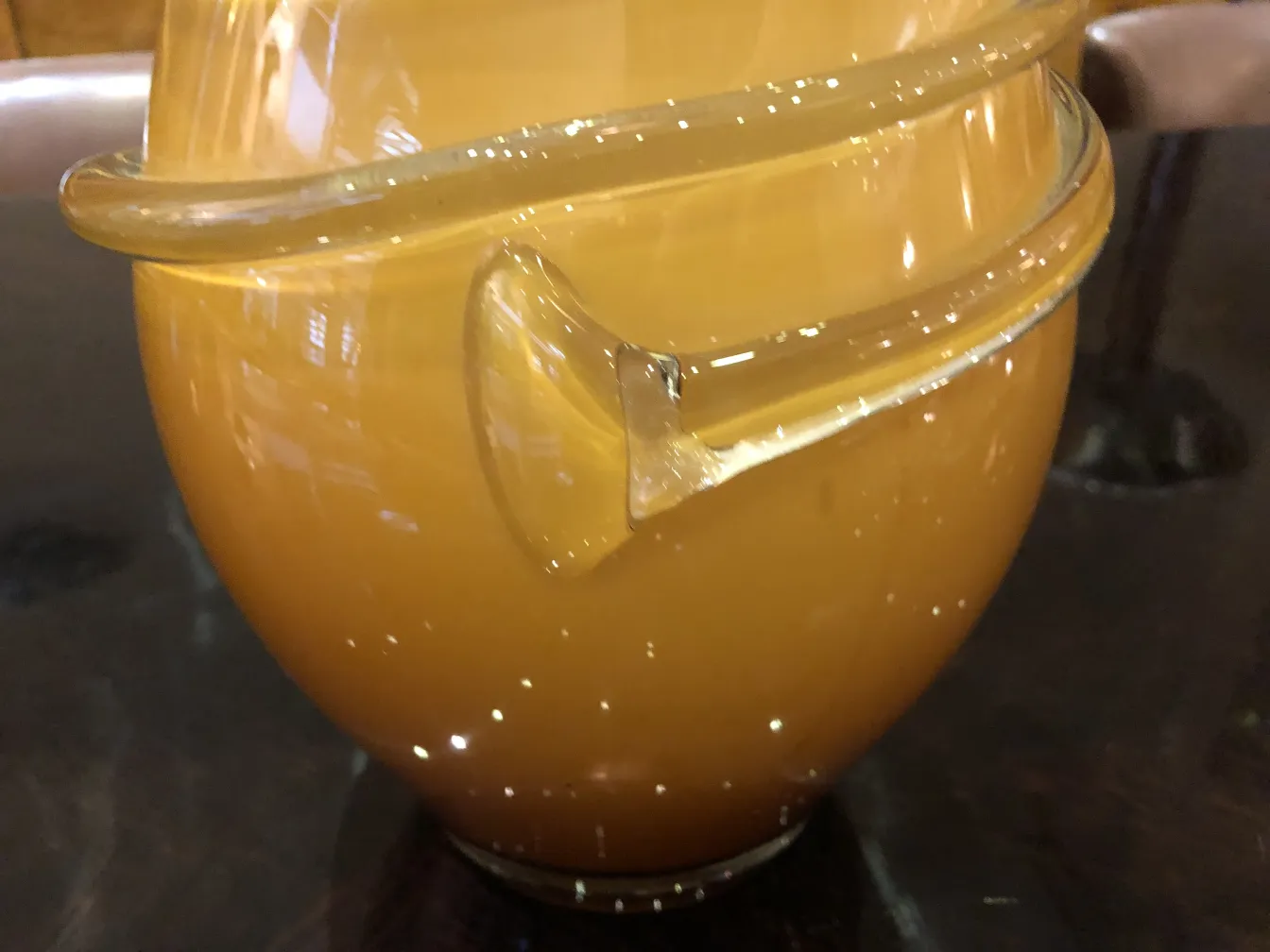 antique yellow vase with a rounded shape and soft decoration