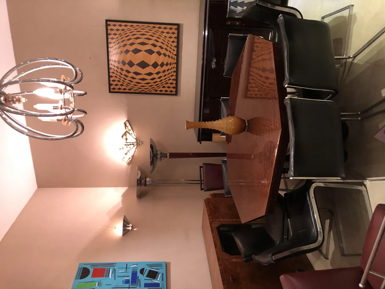 elegant antique vase in a dining room setting with chairs