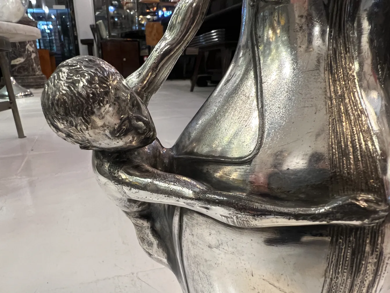 antique vase with a child figure, elegant detail