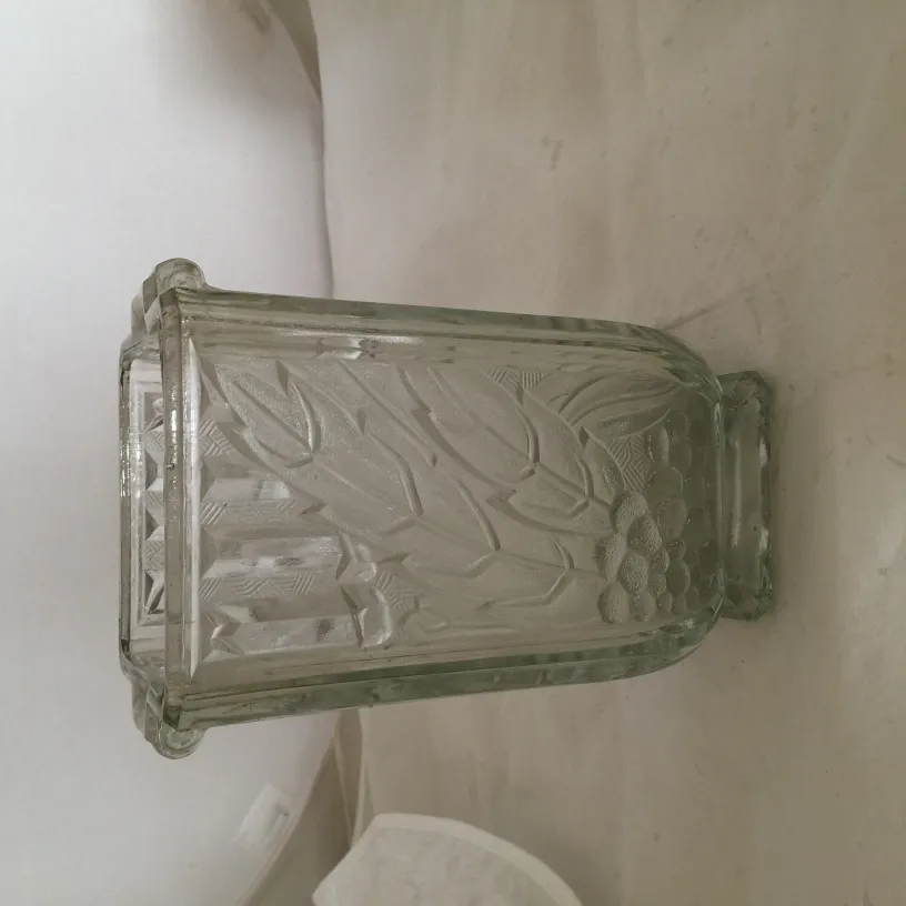 Antique vase decorated with natural motifs in a neutral setting