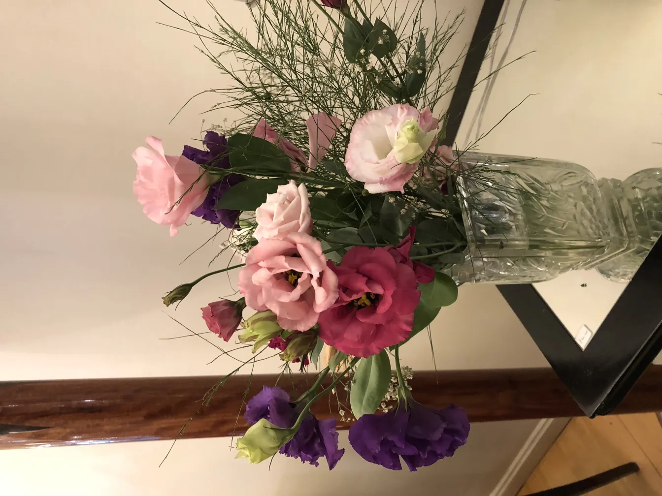 antique vase decorated with various colored flowers