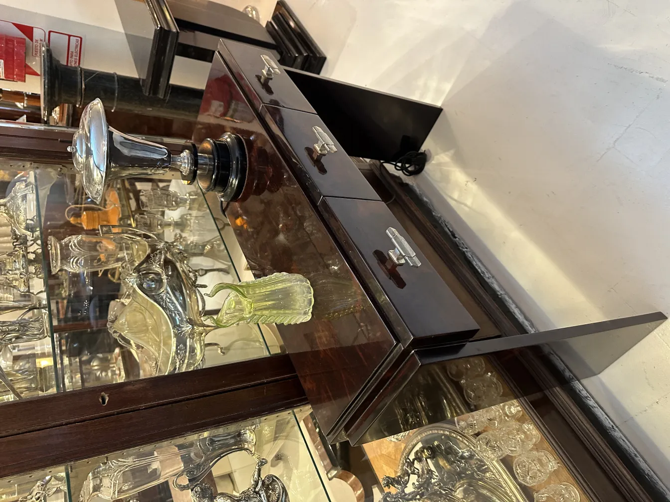 antique vase on a decorative table with other items