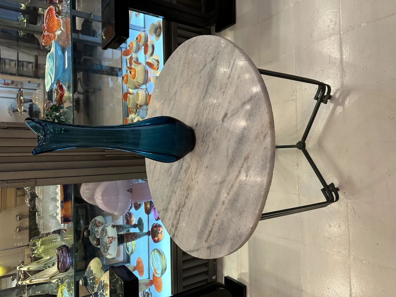antique blue glass vase on a marble table
