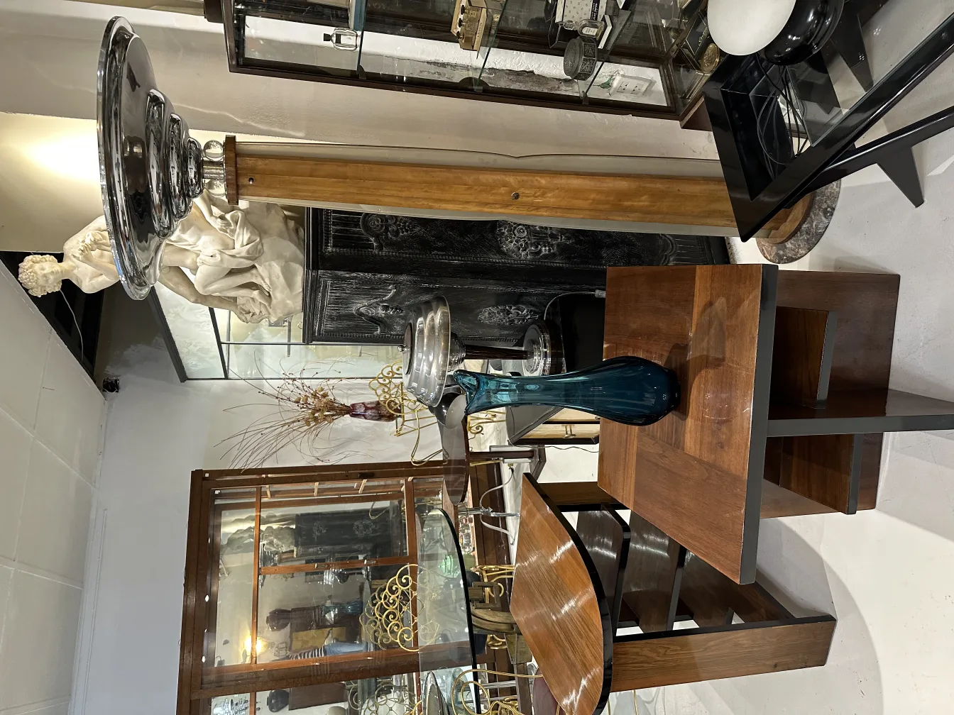 antique vase with elegant shapes and subtle decorations, surrounded by antique items