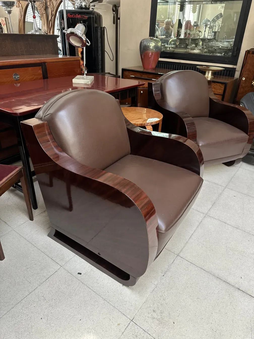 Two antique armchairs in art deco style with elegant design.