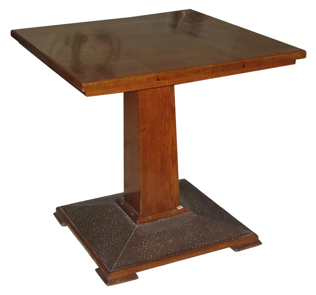 Antique dining table with decorative base and smooth surface, perfect for 4 people.