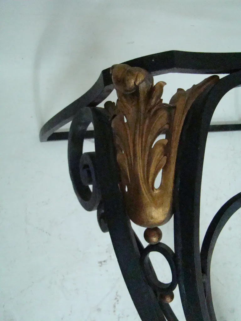 antique console with golden details and decorative structure