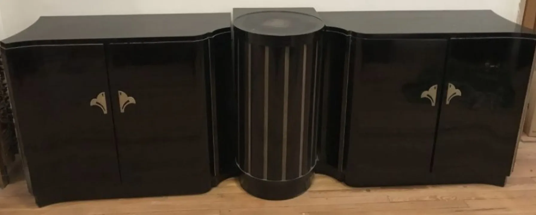 antique sideboard in Art Deco style with golden details and curved lines