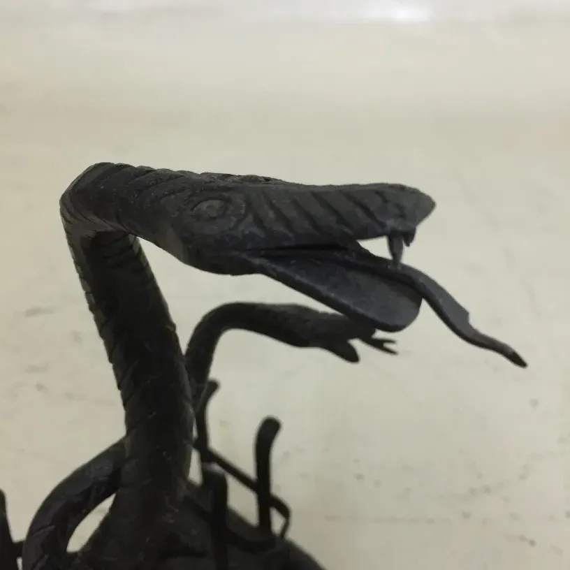 Antique black card tray featuring decorative snake.